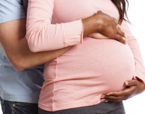 Midwest Fertility Center- couple, pregnant woman